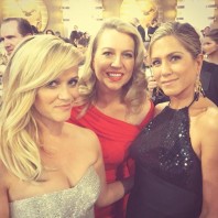 Cheryl Strayed (middle, in red) with Reese Witherspoon and Jennifer Aniston at the Golden Globes