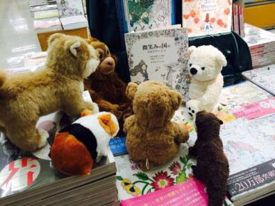 Stuffed animals exploring books