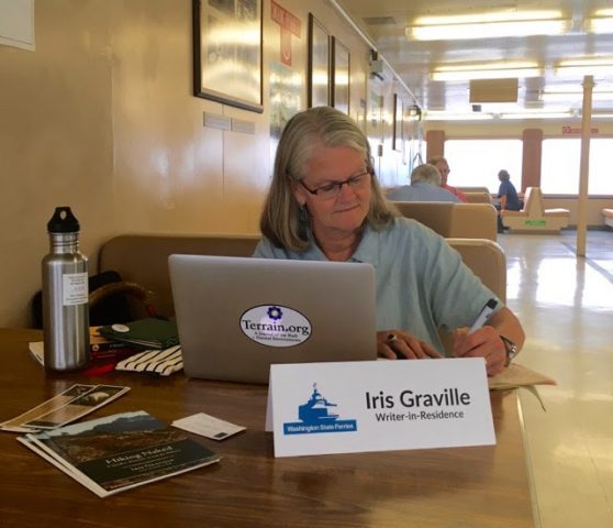 Iris Graville writing on the ferry
