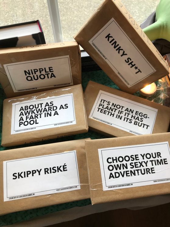 brown paper-wrapped books with all caps labels such as "NIPPLE QUOTA," "ABOUT AS AWKWARD AS A FART IN A POOL," "KINKY SH*T," and "IT'S NOT AN EGGPLANT IF IT HAS TEETH IN ITS BUTT"