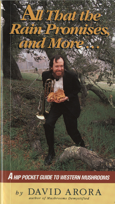 All That the Rain Promises and More (photo of a man with a tuxedo and a brass instrument standing by a giant mushroom)