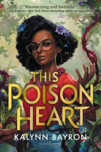A young Black woman with flowers in her hair and lush vines and plants around her faces out from the cover of "This Poison Heart" by Kalynn Bayron