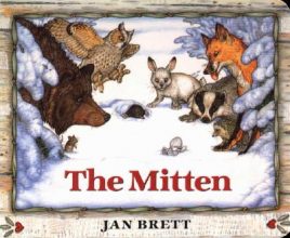 The Mitten by Jan Brett book cover (illustration showing woodland animals all looking at a mitten in the snow)