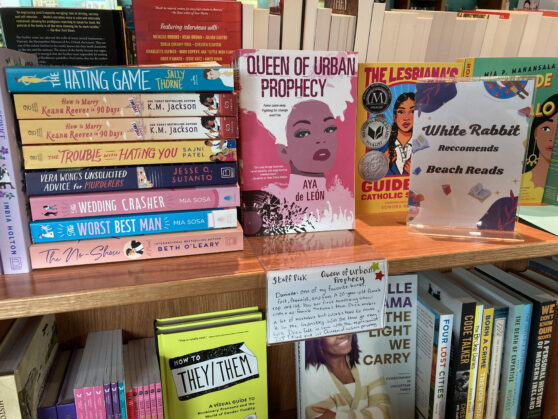 Bookstore display of "White Rabbit Recommends Beach Reads" including "Queen of Urban Prophecy" with shelftalker