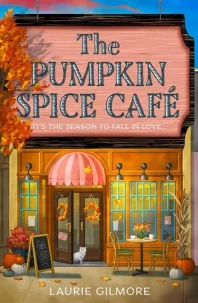 Cover of The Pumpkin Spice Cafe, featuring illustration of a cozy cafe with a fall tree outside and a white cat in the doorway
